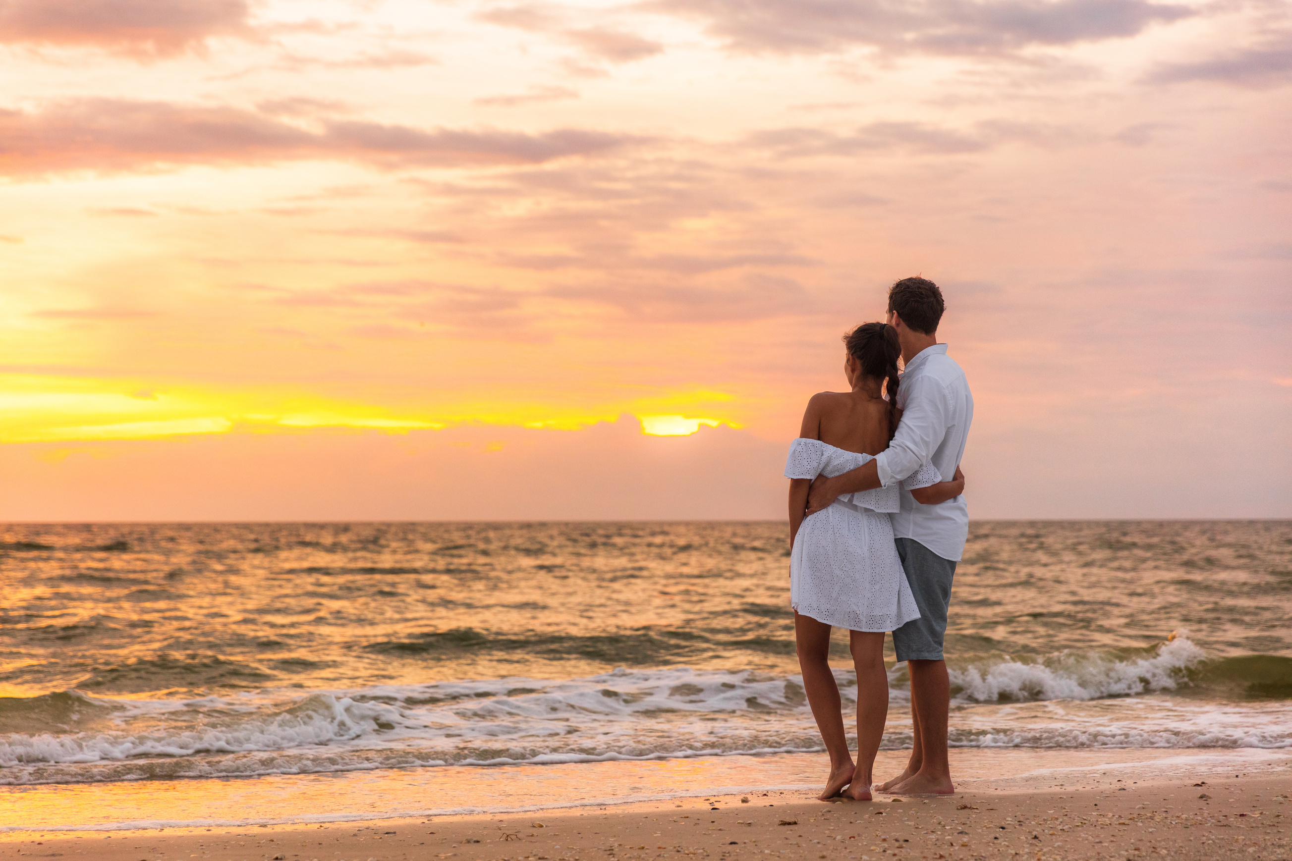 Couple Enjoying the Sunset at the Beach